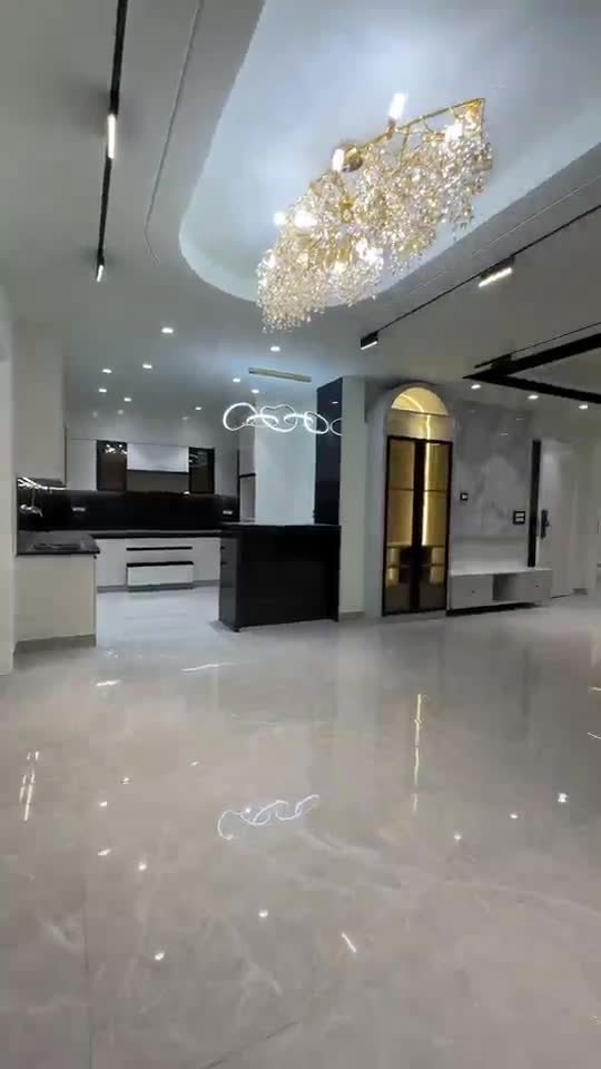 Modern flat lobby with false ceiling and marble flooring – GharVistaar interior fit-out